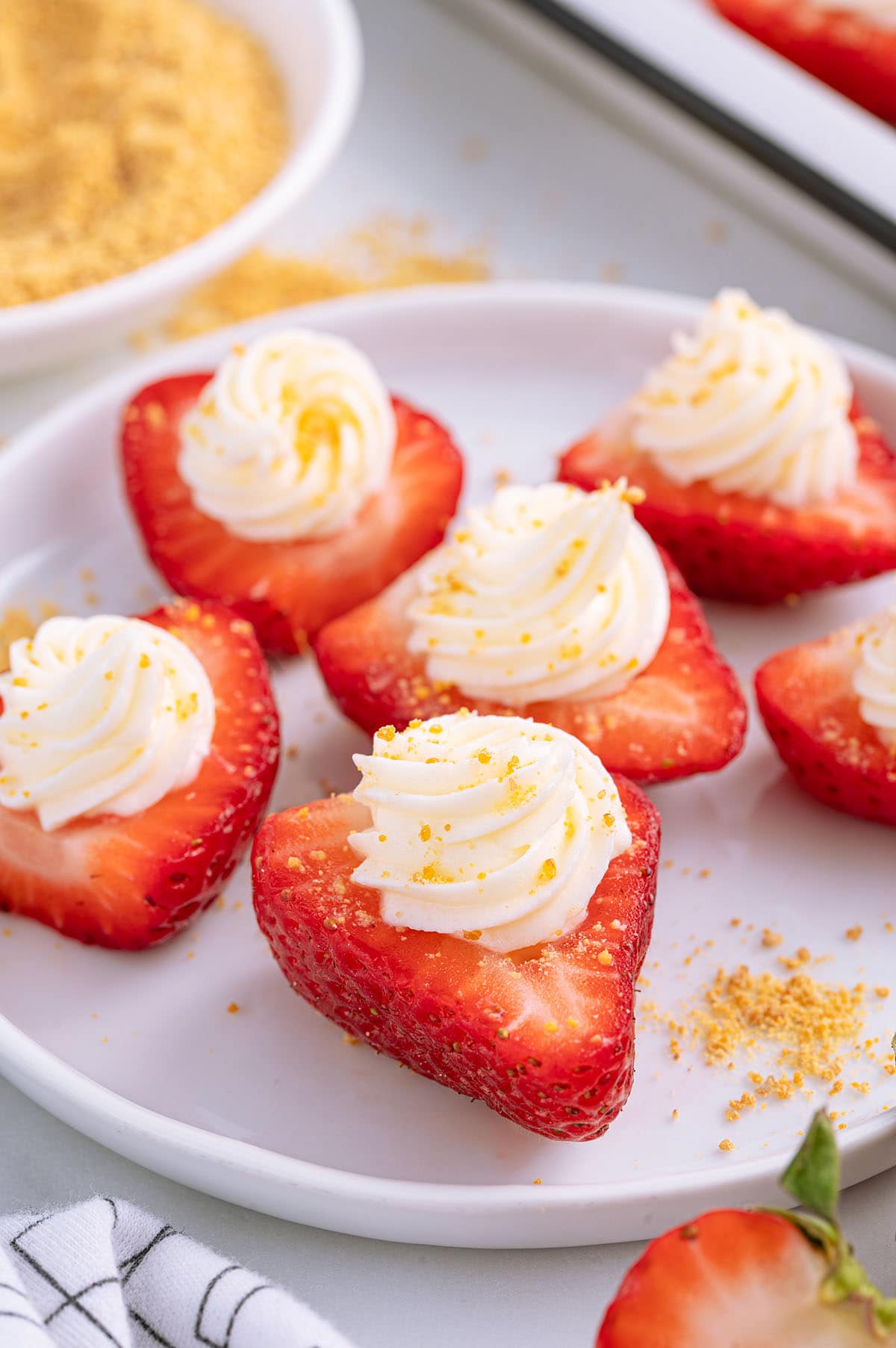 a couple of Deviled Strawberries on a white plate.