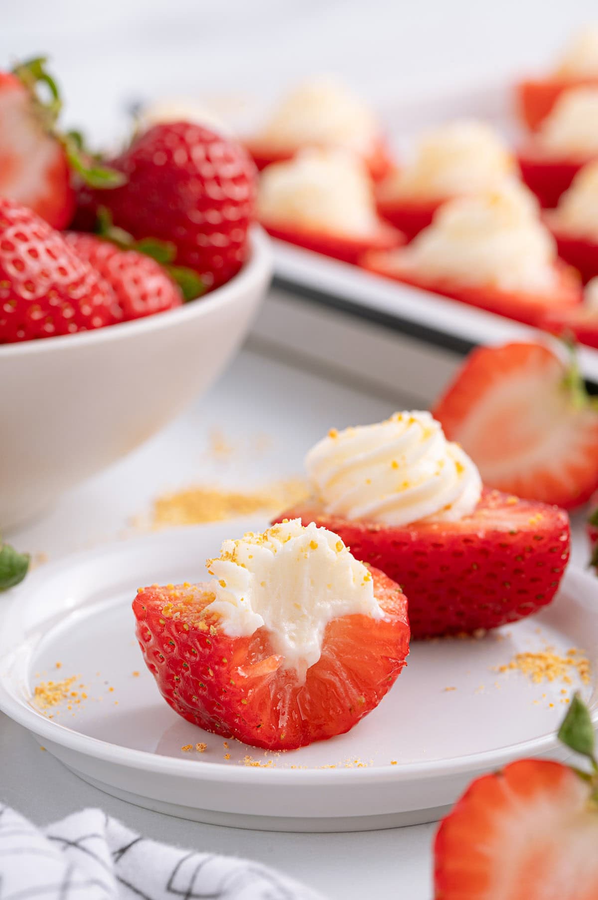 bitten deviled strawberries with cream cheese filling.