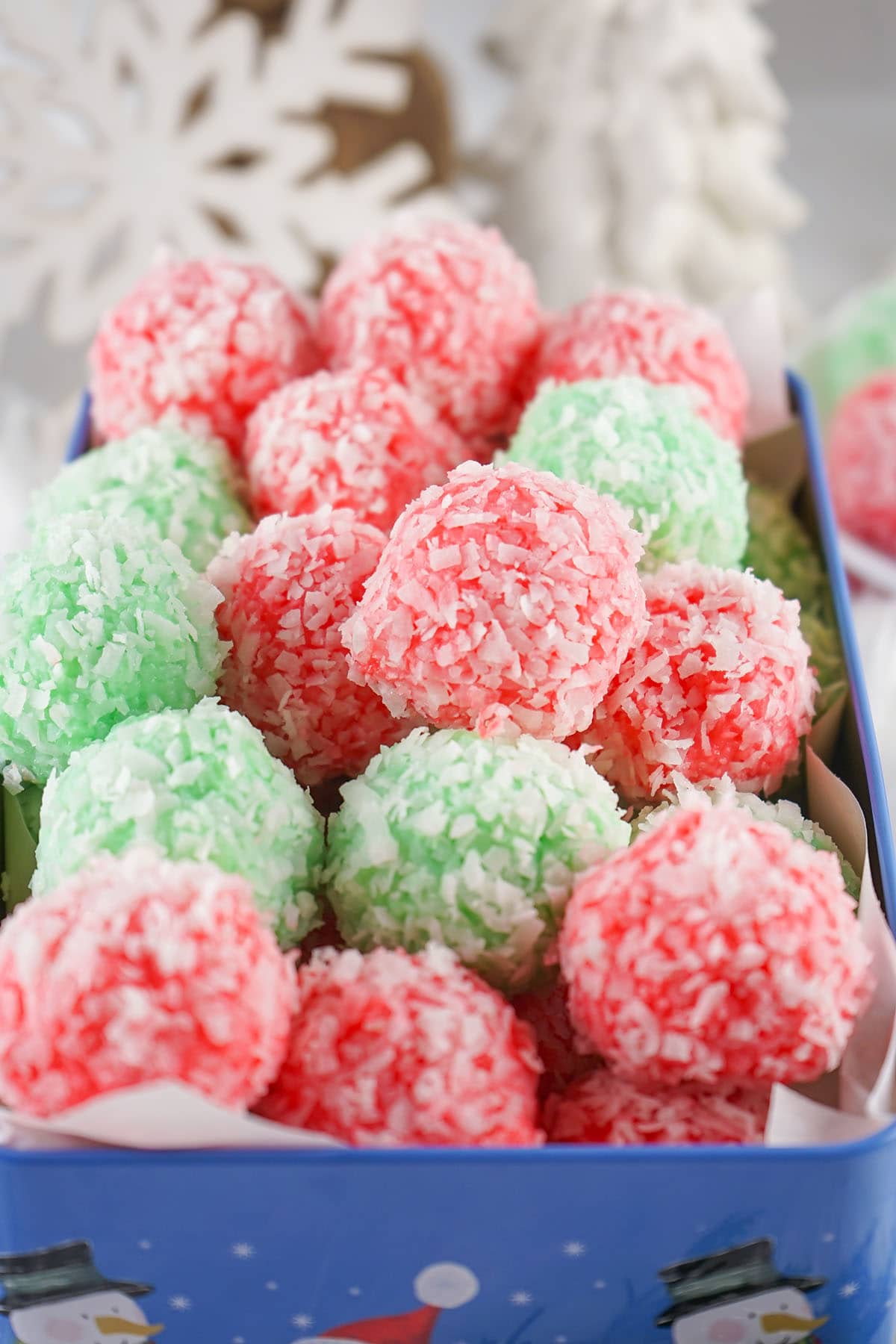 a couple of Christmas jello balls in a rectangular container.