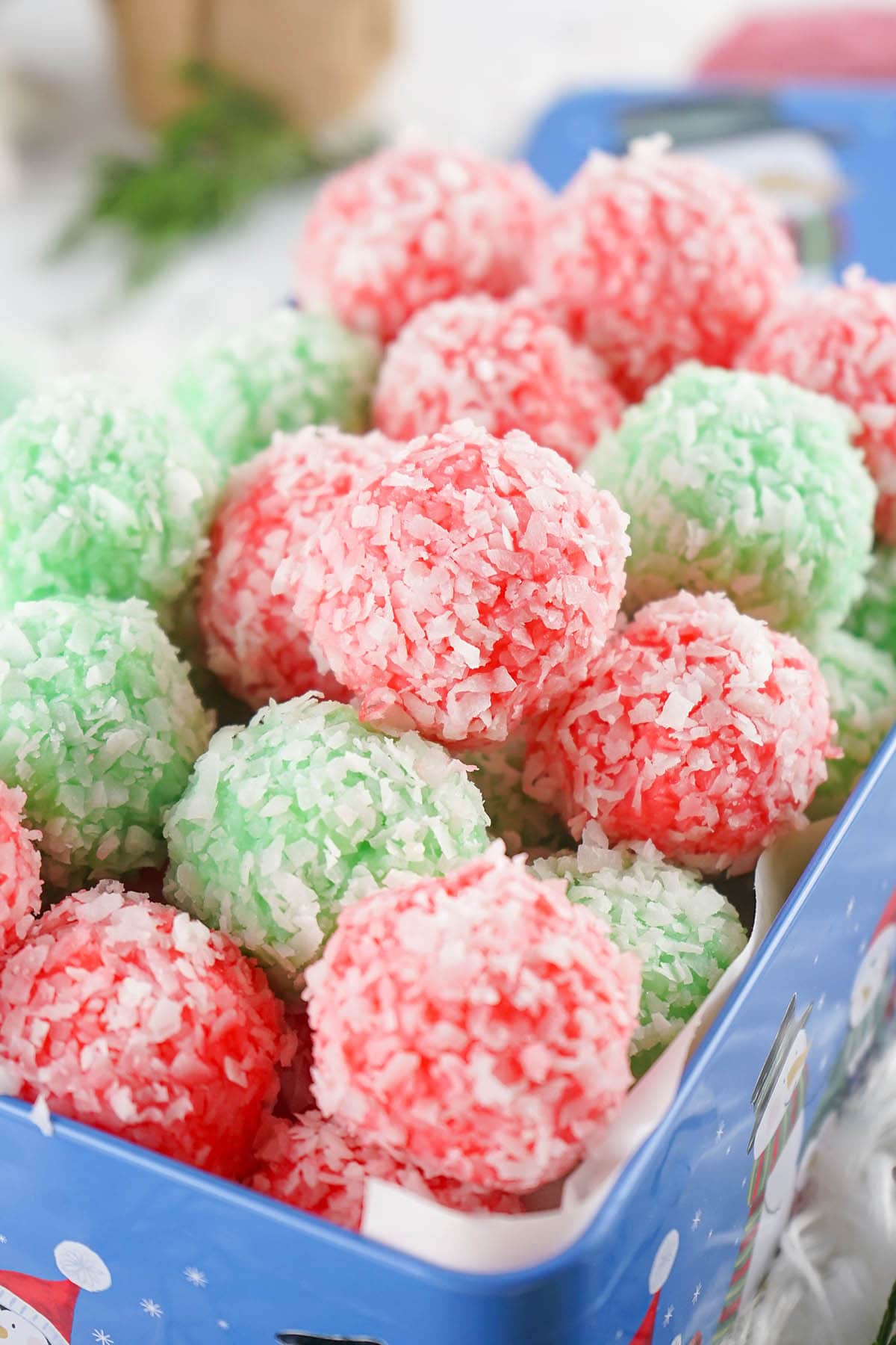 a couple of Christmas jello balls in a container.