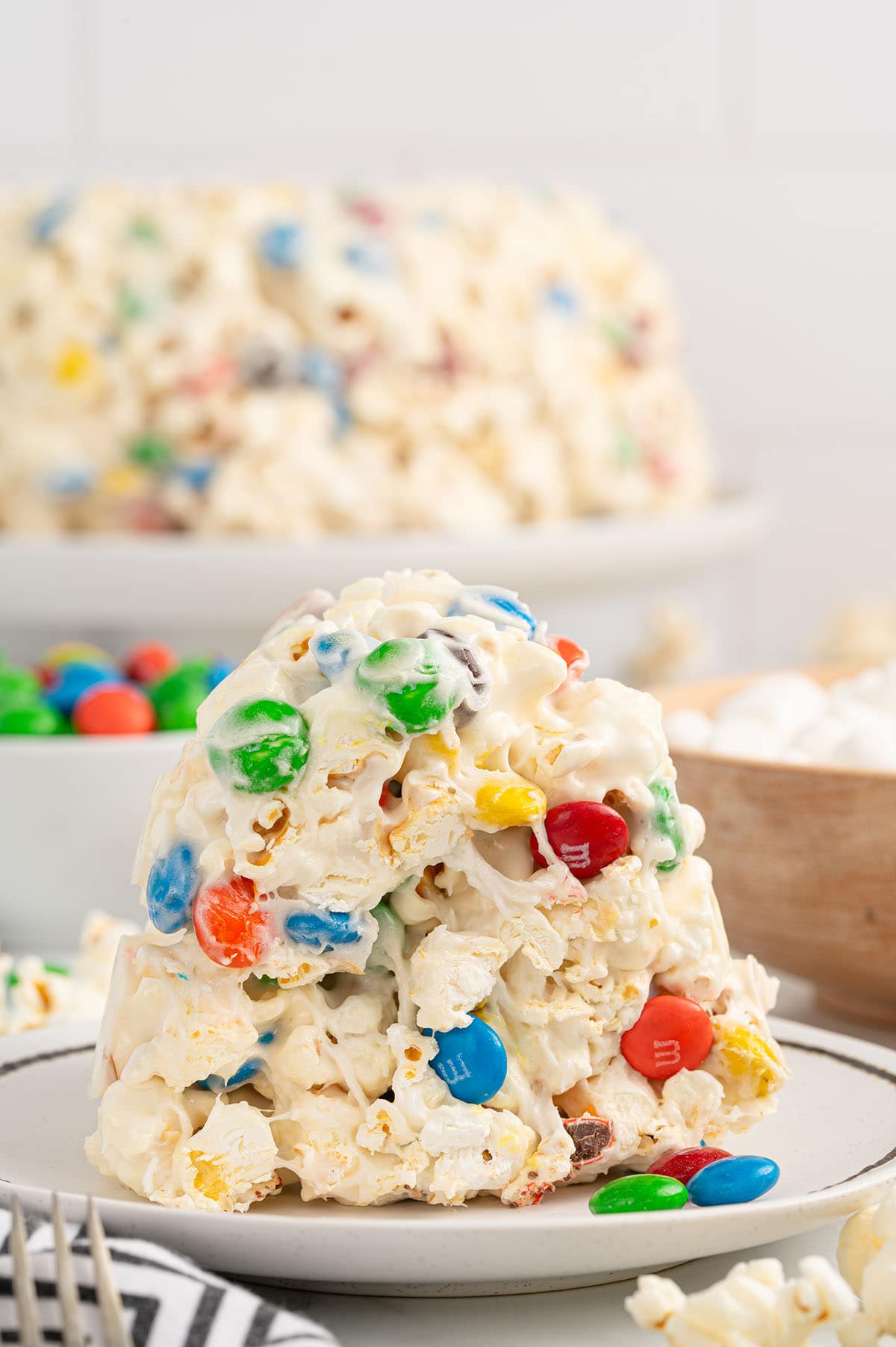 a slice of popcorn cake with M&M's.