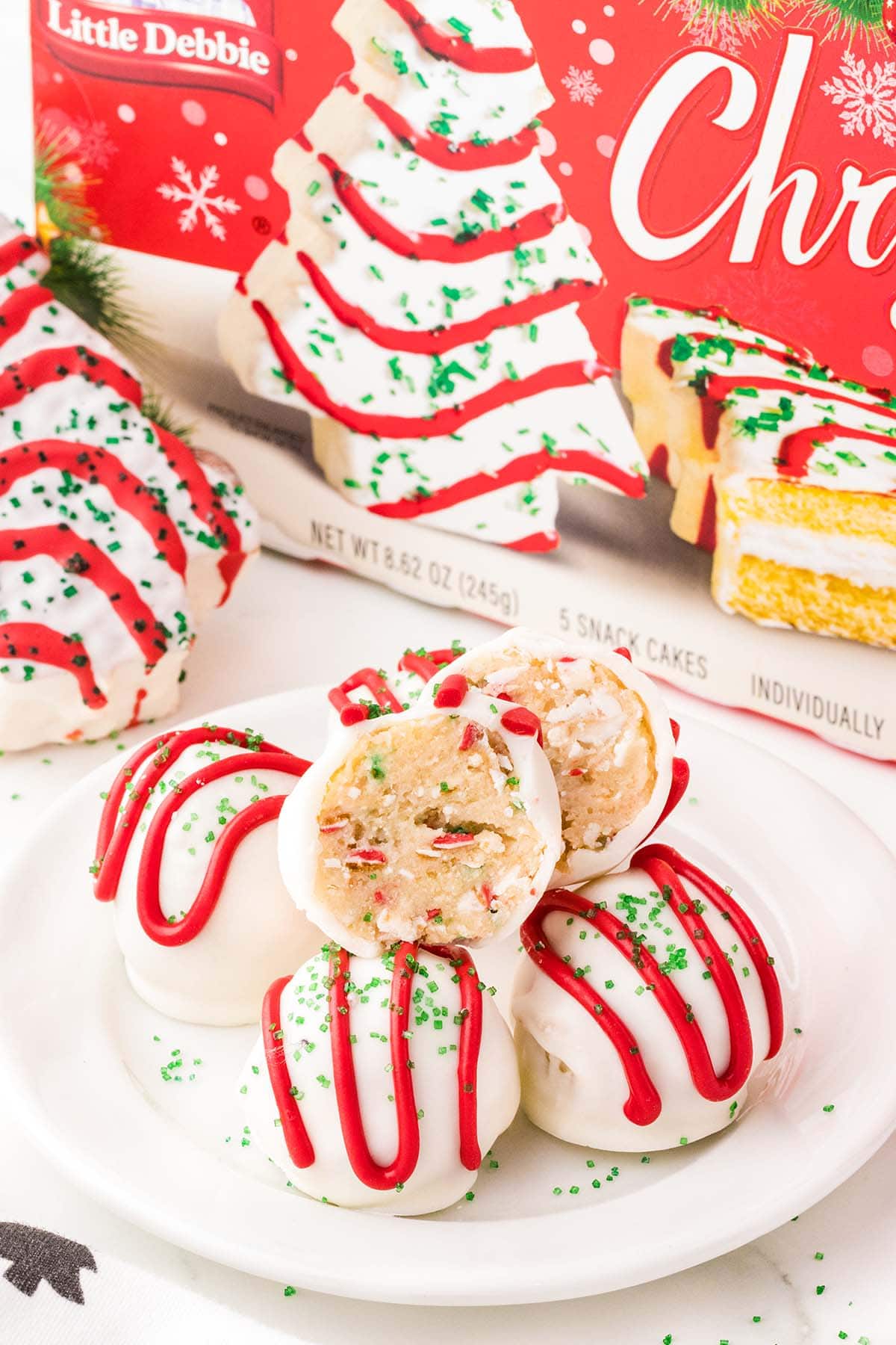 Little Debbie Christmas Tree Cake Balls with a package of Little Debbie Christmas Tree Cakes visible in the background.