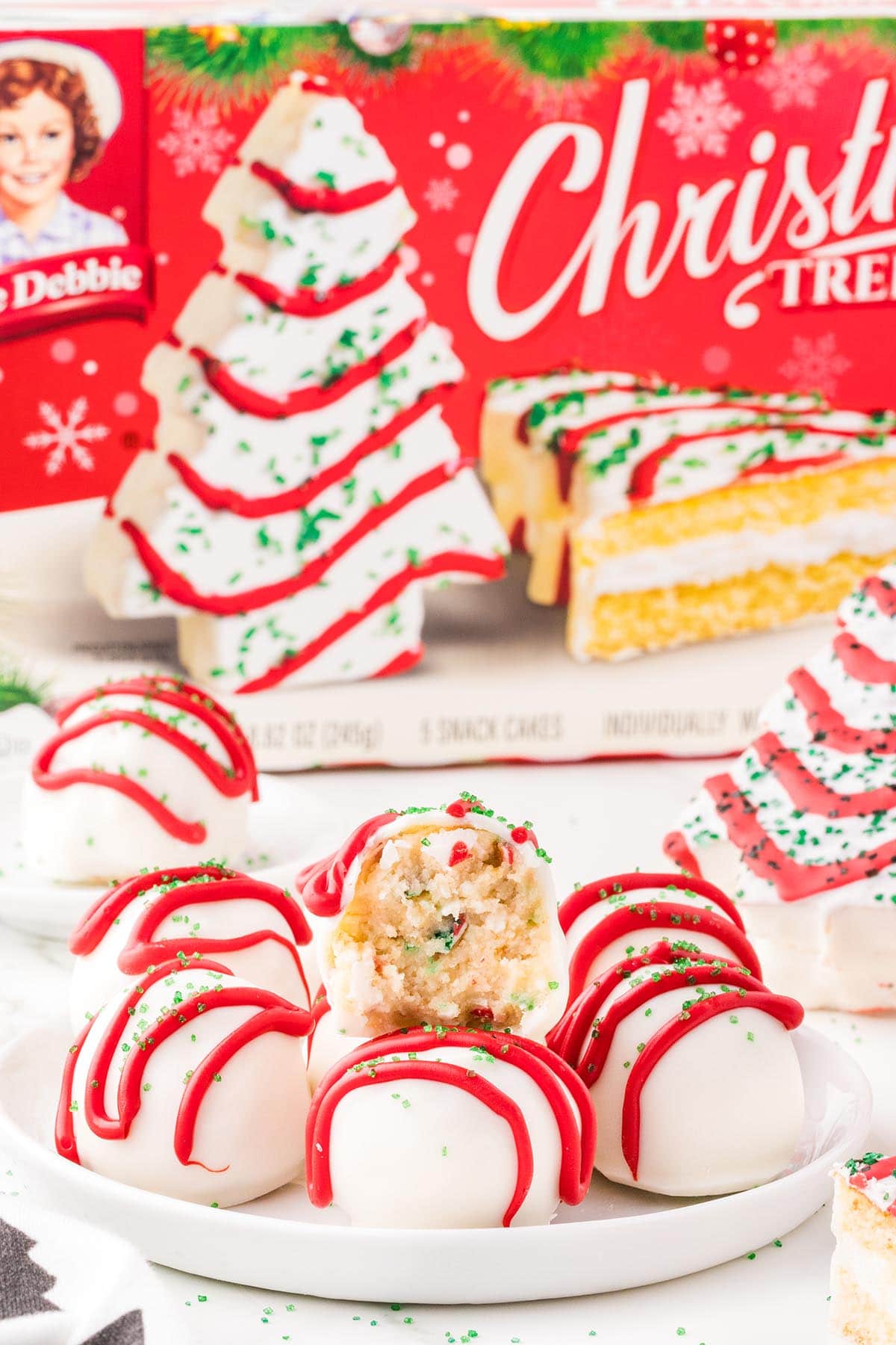 little debbie christmas tree cake balls with a box of little debbie at the back. 