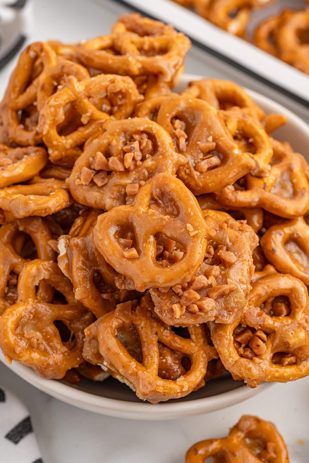 A bowl of butter toffee pretzels.