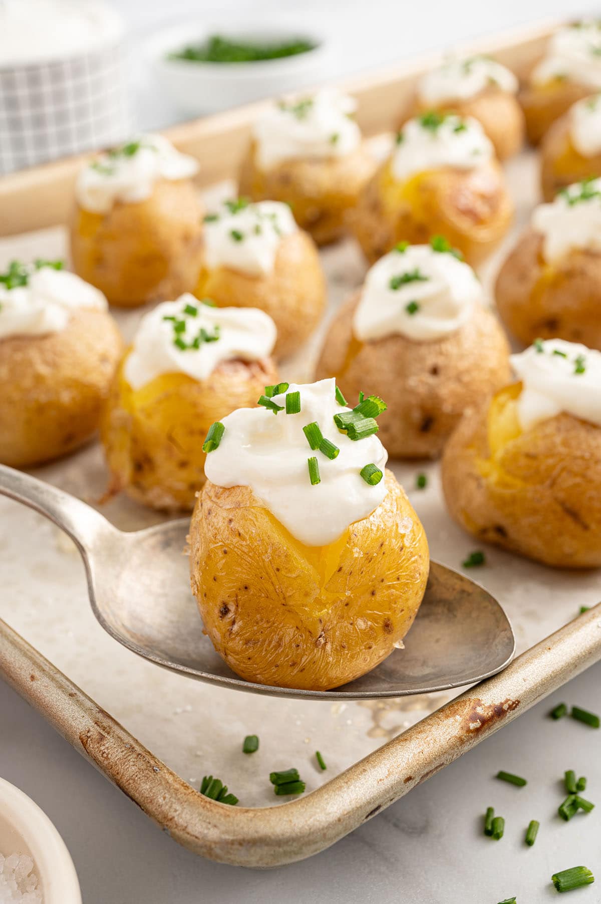 Mini baked potato on a spoon.