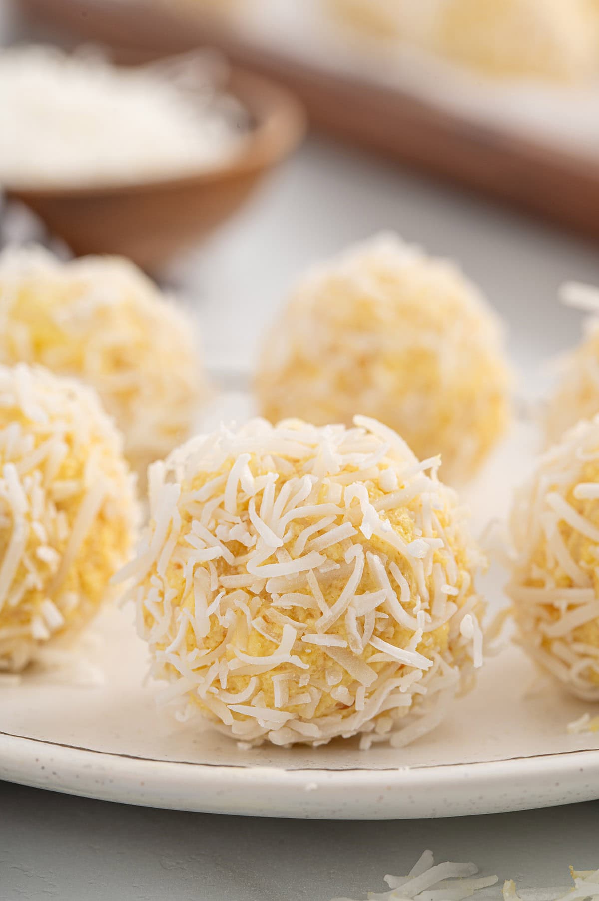 pineapple balls on a plate. 