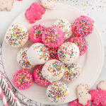 Circus Animal Cookie Balls with pink, white chocolate, and sprinkles.