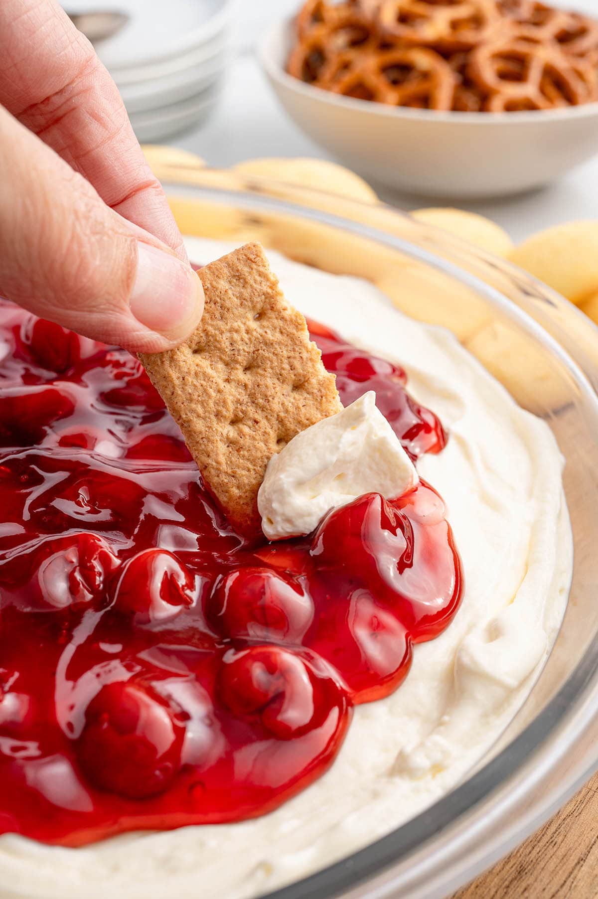 Cherry cheesecake dip with a graham cracker scoop.