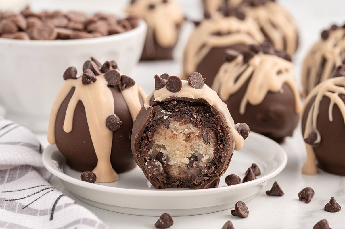 Chocolate chip cookie dough brownie bombs with peanut butter drizzle.