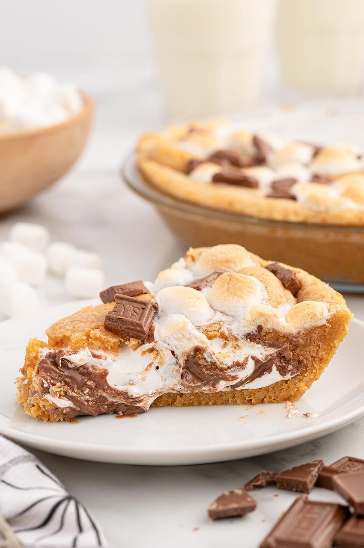 S'mores pie slice with melted chocolate and gooey marshmallows.