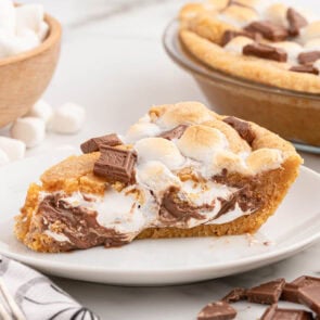 S'mores pie slice with toasted marshmallows and melted chocolate.