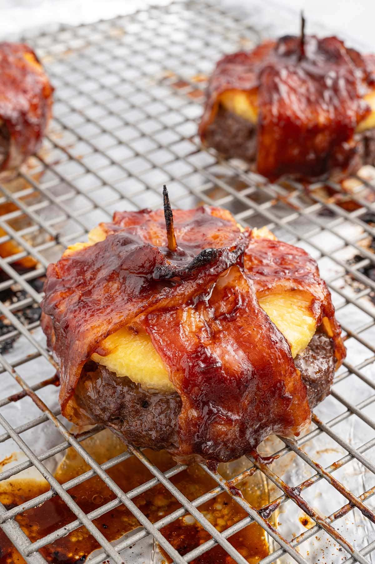 baked pineapple burger on top of cooling rack.