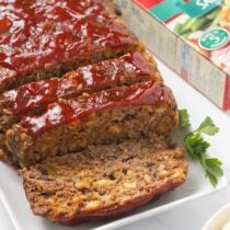 Stove Top Stuffing Meatloaf with a glossy ketchup glaze, sliced and ready to serve.