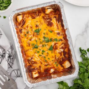 Freezer Enchiladas topped with melted cheese and cilantro.