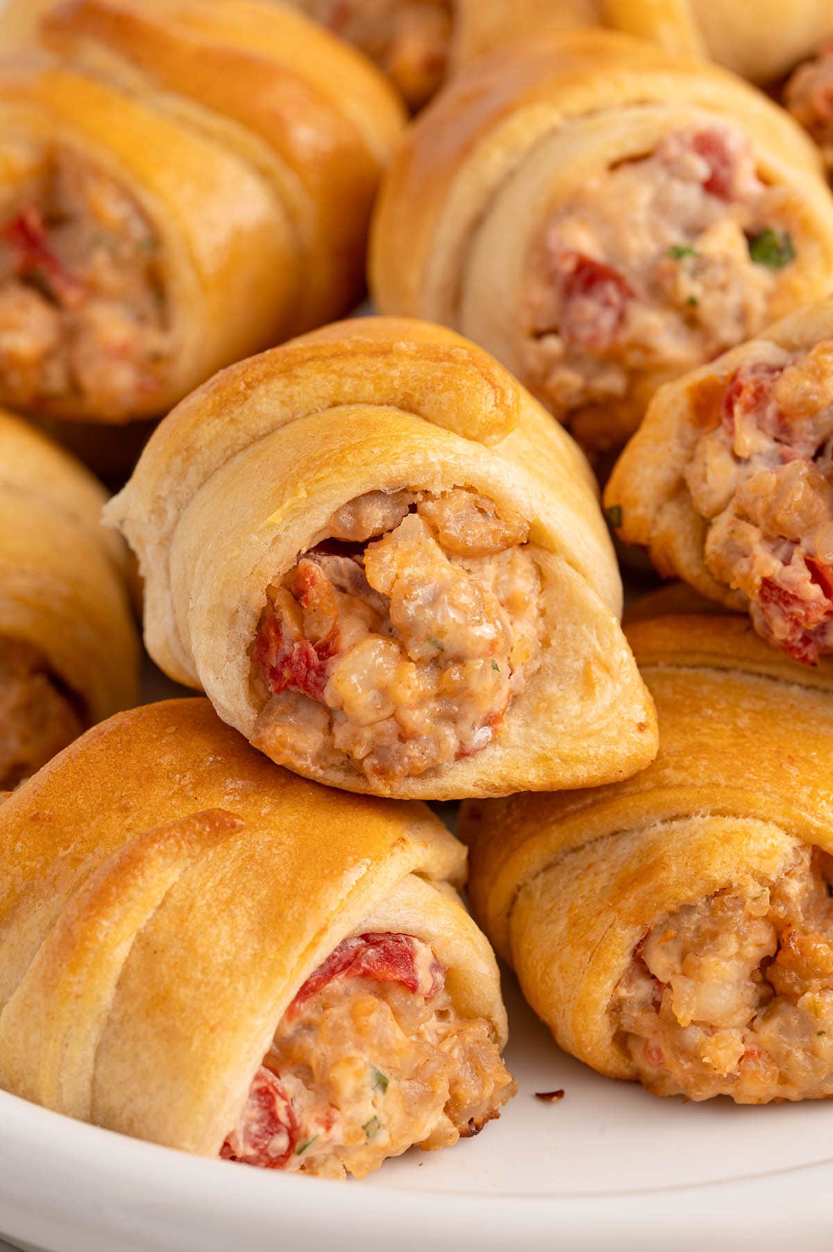 Sausage Cream Cheese Crescent Rolls on a white plate.