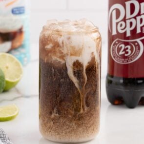 dirty dr pepper served in a glass.