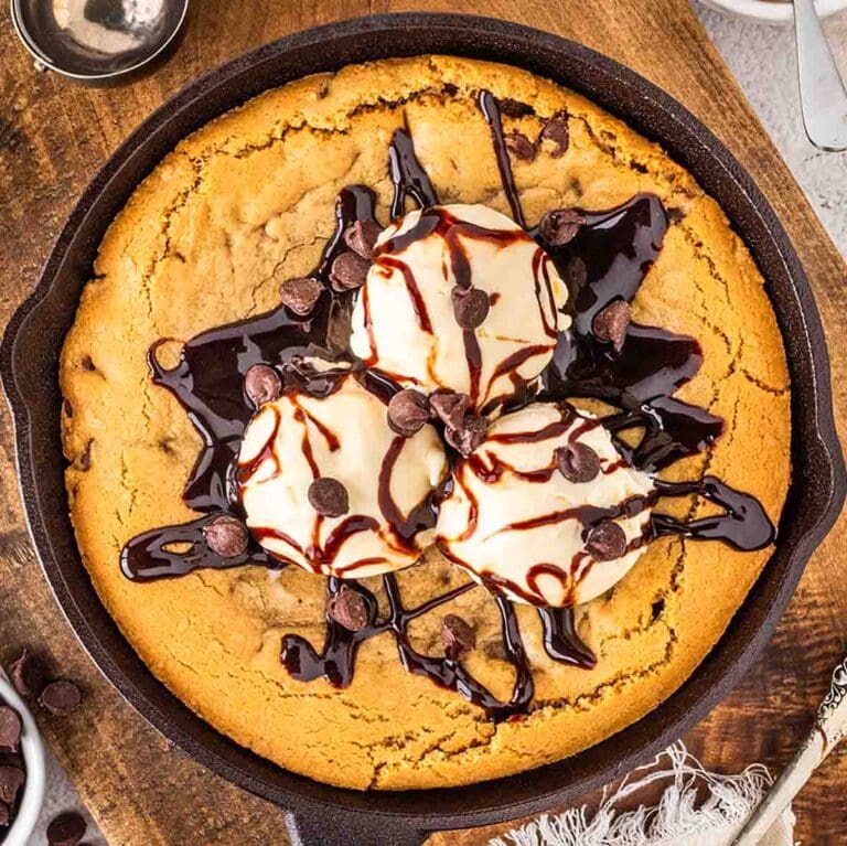 Pizookie with ice cream and chocolate sauce.