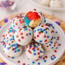 Red, white, and blue cake bombs with star sprinkles and a colorful layered center.