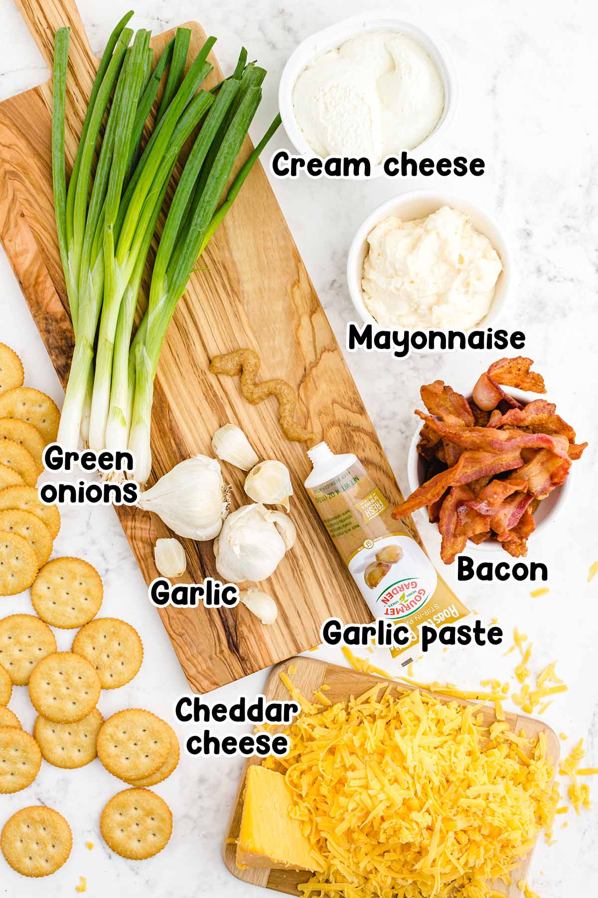 Million dollar dip ingredients, including cream cheese, mayonnaise, green onions, cheddar cheese, bacon and garlic