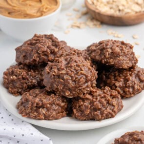 a couple chocolate peanut butter no bake cookies on top of the plate.