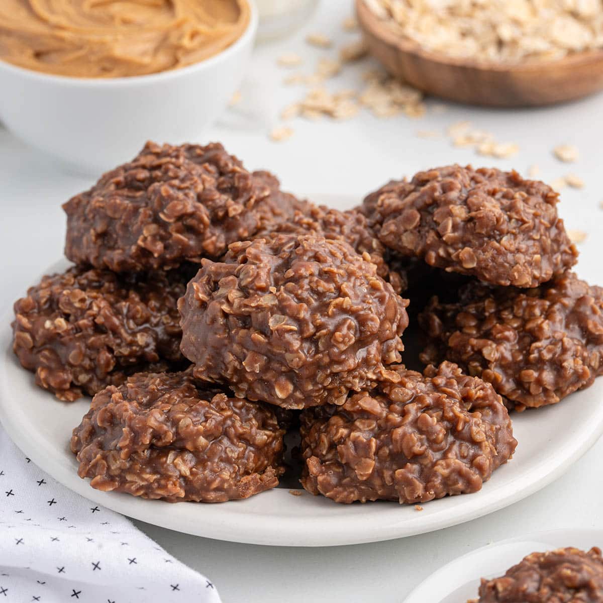 a couple chocolate peanut butter no bake cookies on top of the plate. 