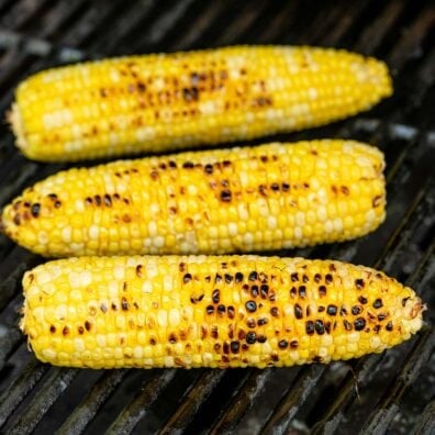 three pieces of grilled corn on the cob.
