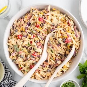 A bowl of fresh Mexican coleslaw with colorful veggies and creamy dressing.
