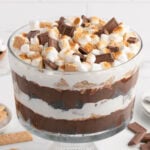 S'mores trifle with chunks of chocolate, graham crackers, and fluffy marshmallows on top.