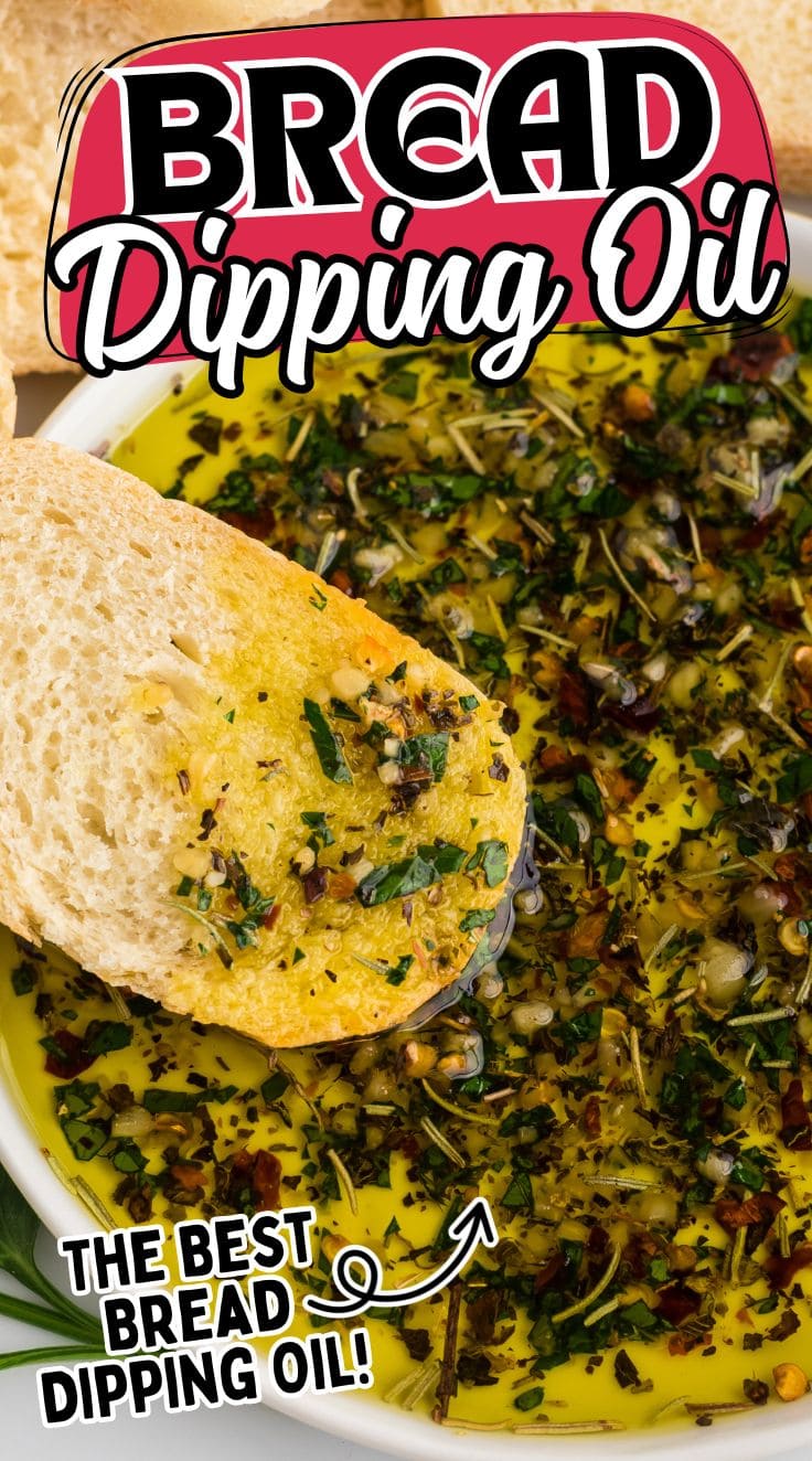 A piece of bread digging into Bread Dipping Oil in a plate
