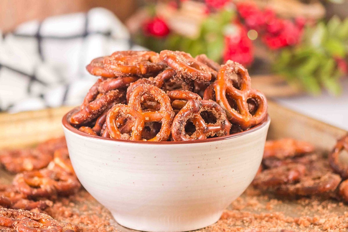 Sweet and crunchy pretzels coated with cinnamon sugar in a white bowl.