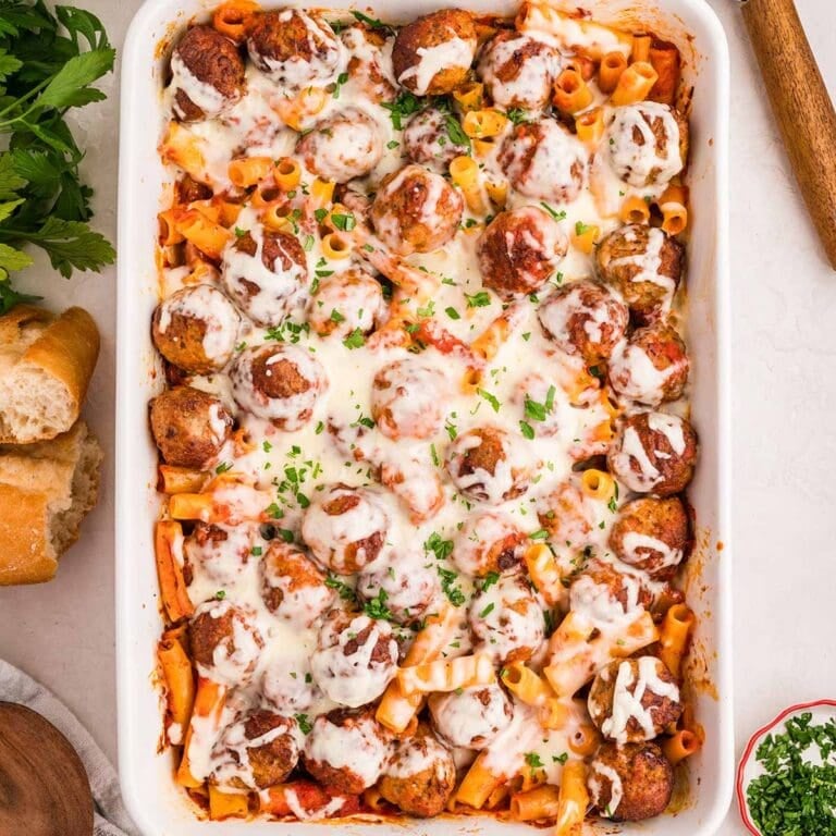A warm meatball casserole baked with rigatoni pasta and gooey cheese on top.