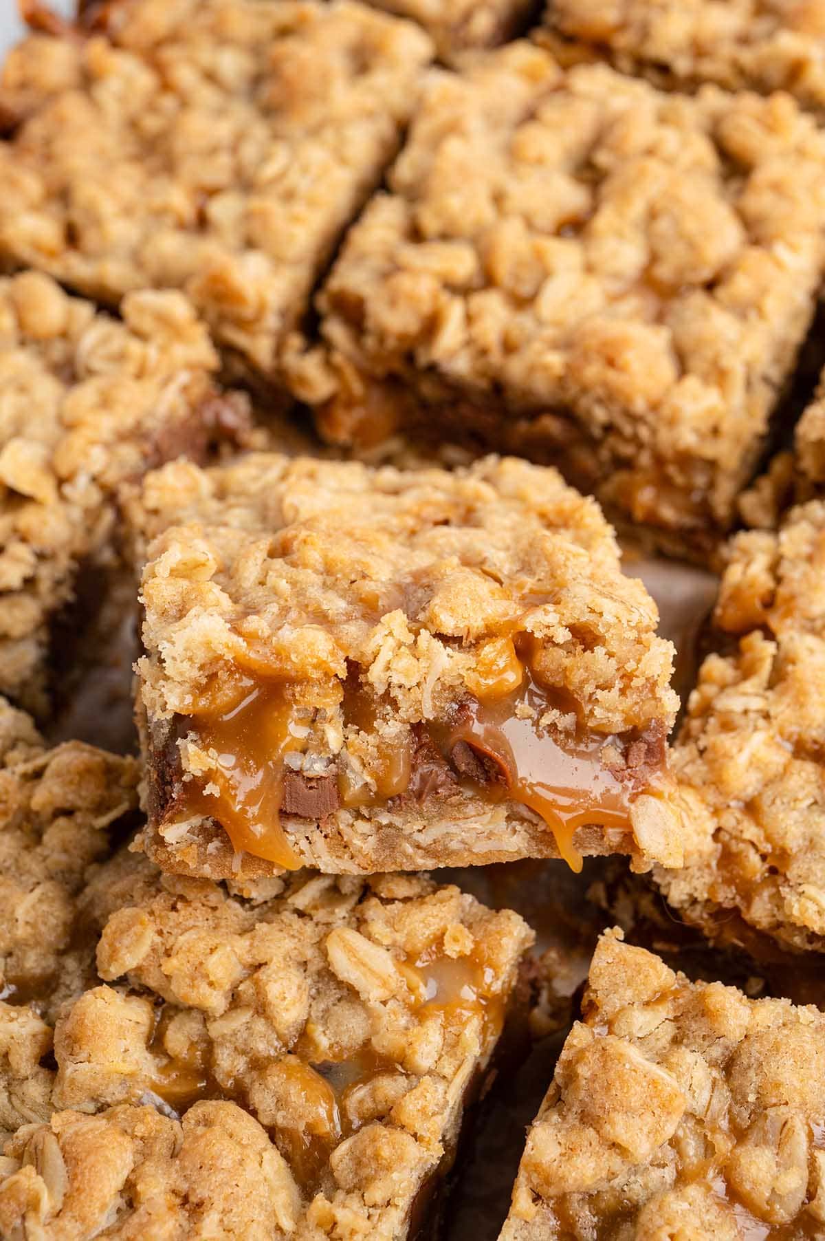 Thick carmelitas with crunchy texture and melted caramel dripping out.