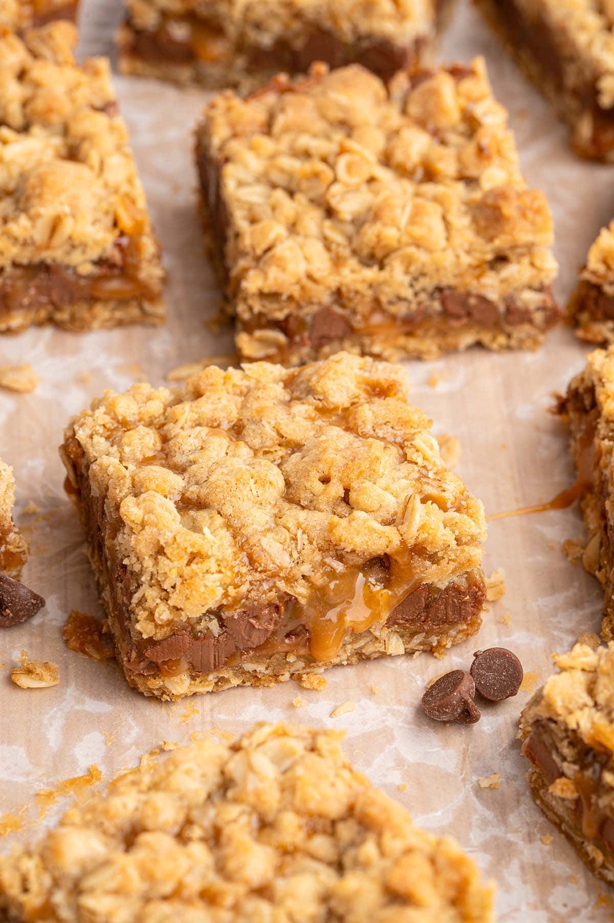 Square sliced carmelitas with gooey caramel and chocolate filling.