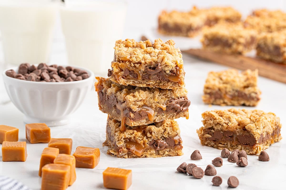 A stack of carmelitas with melted chocolate and caramel dripping.