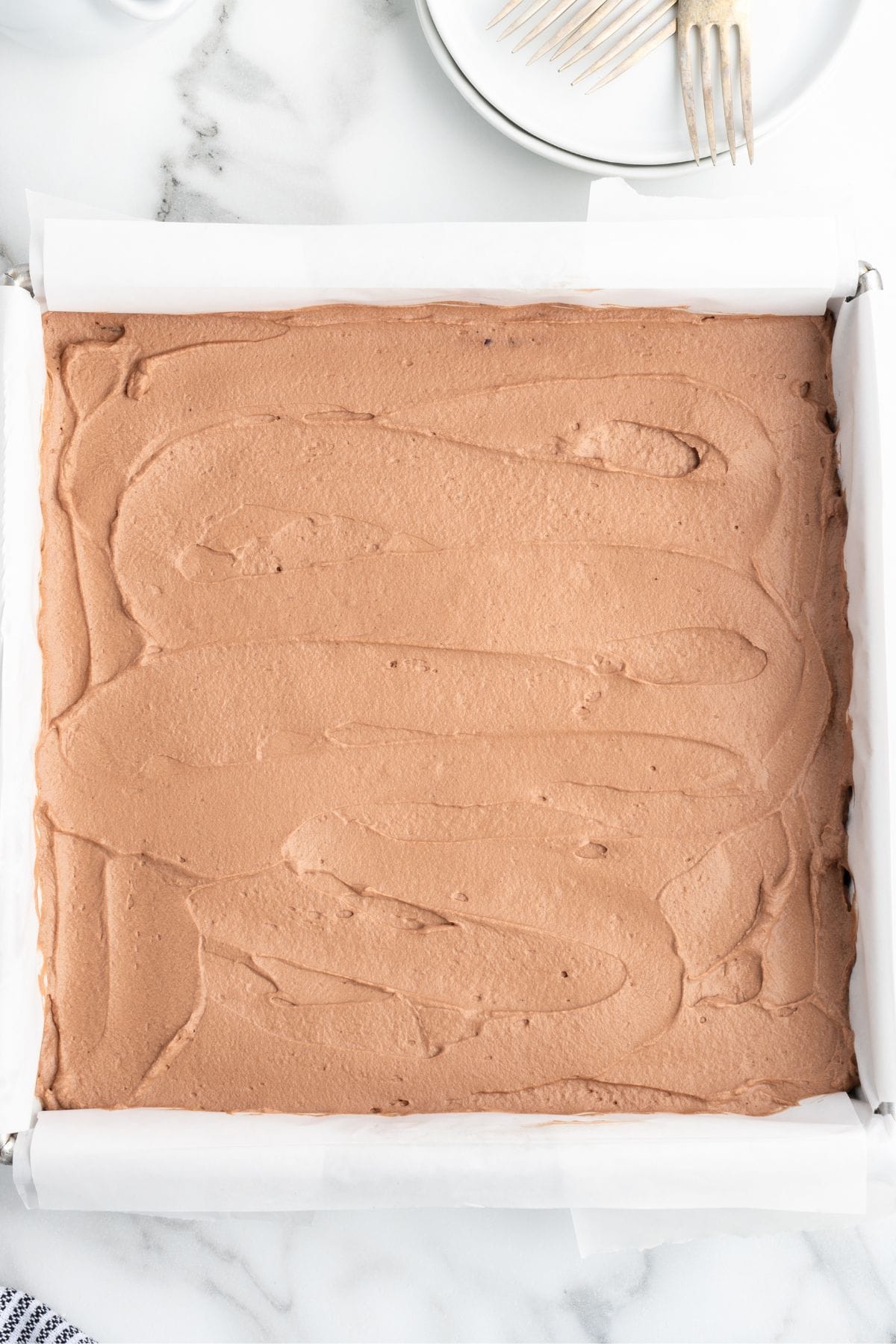 Finished Chocolate Mousse Brownies in a baking pan, ready to be served