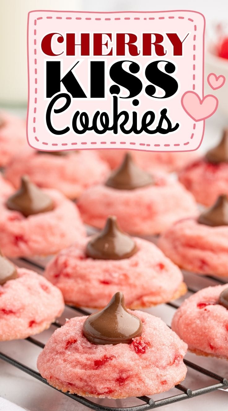 Close up of Pink Cherry Kiss Cookies lined on a cooling rack.