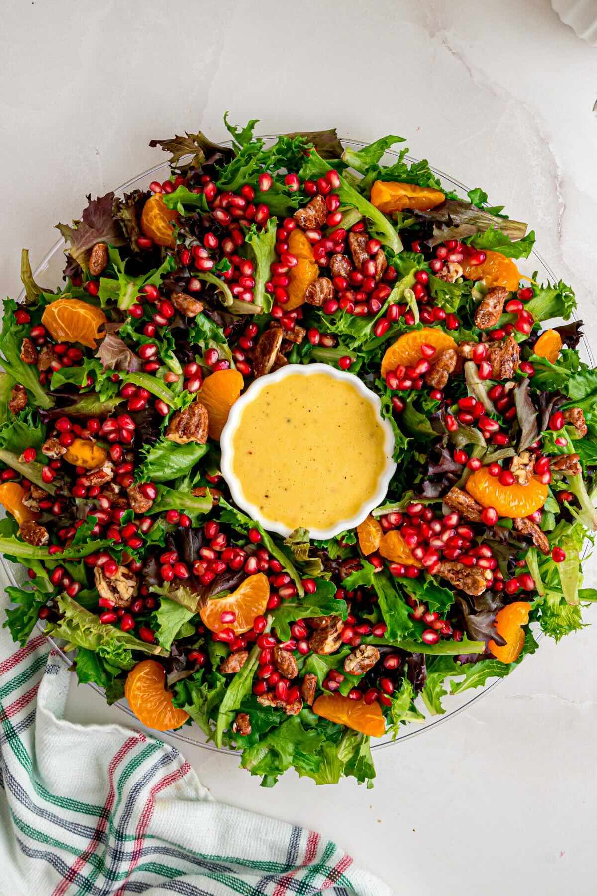 layering salad ingredients around the dressing.