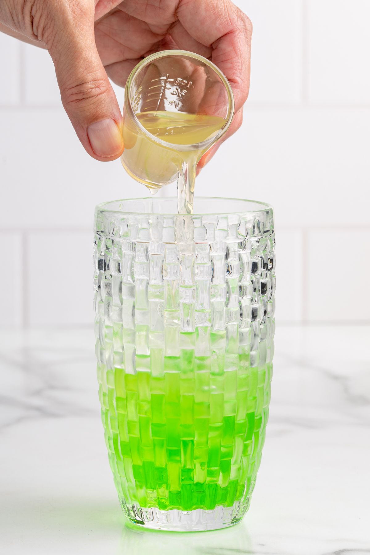 pour the ingredients into the shaker. 