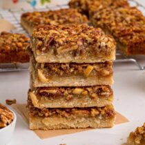 pecan pie bars stacked on top of each other.