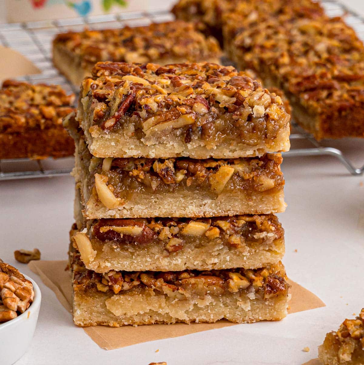 pecan pie bars stacked on top of each other.