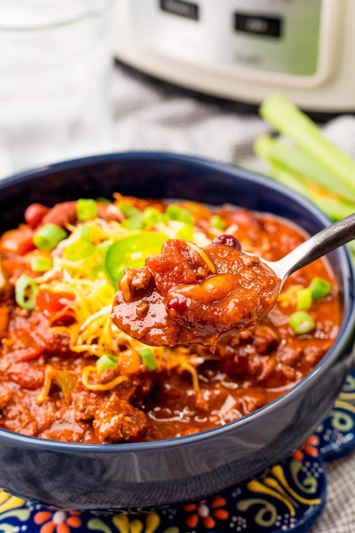eating slow cooker chili with a spoon.
