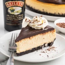 baileys cheesecake slice on a plate.