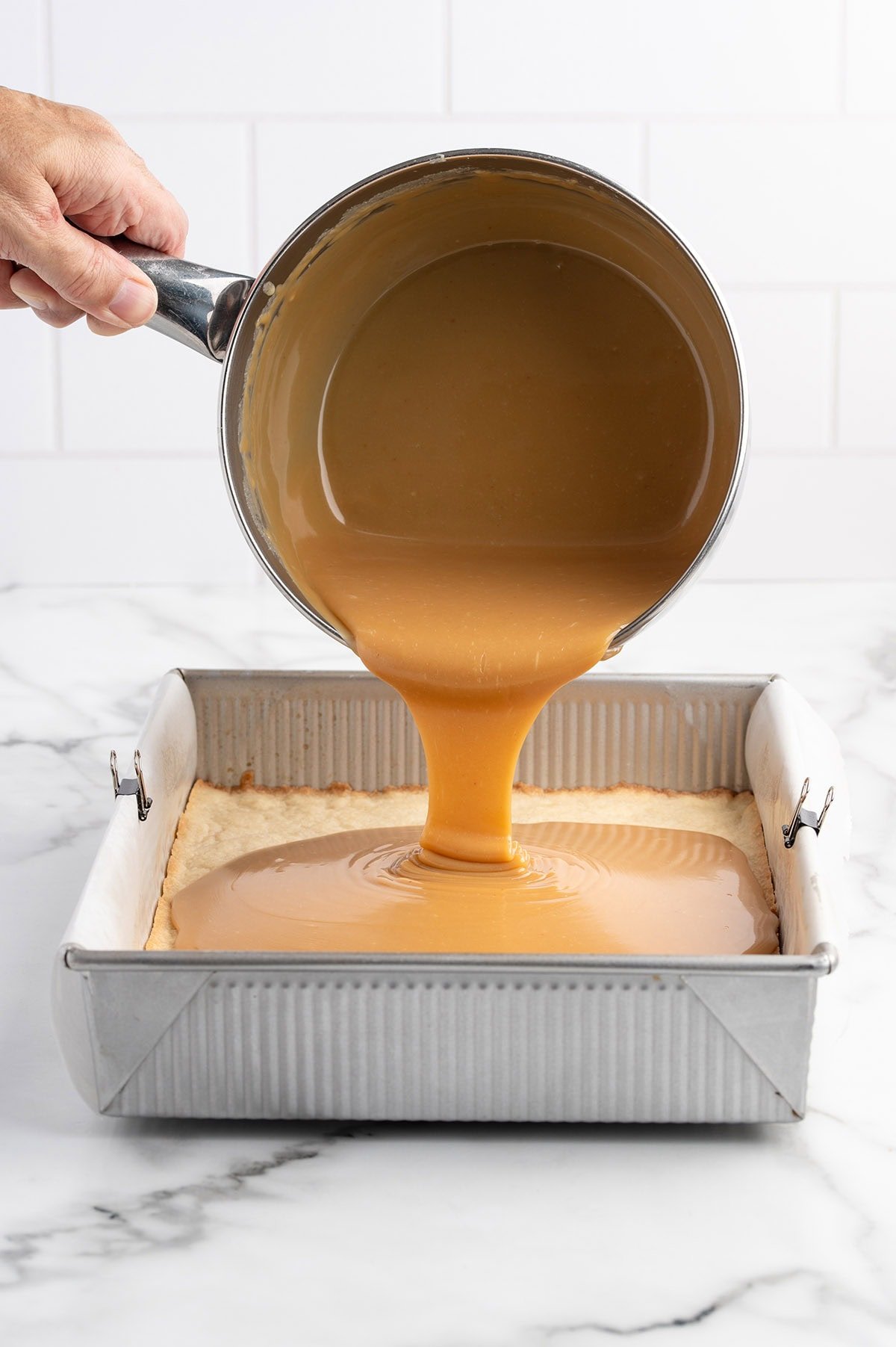 pour caramel into the cookie crust. 
