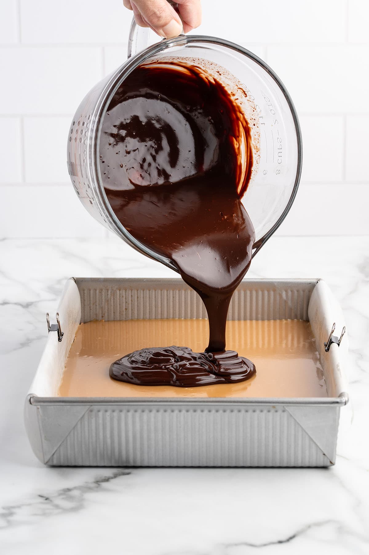 pour chocolate layer on top of the caramel. 
