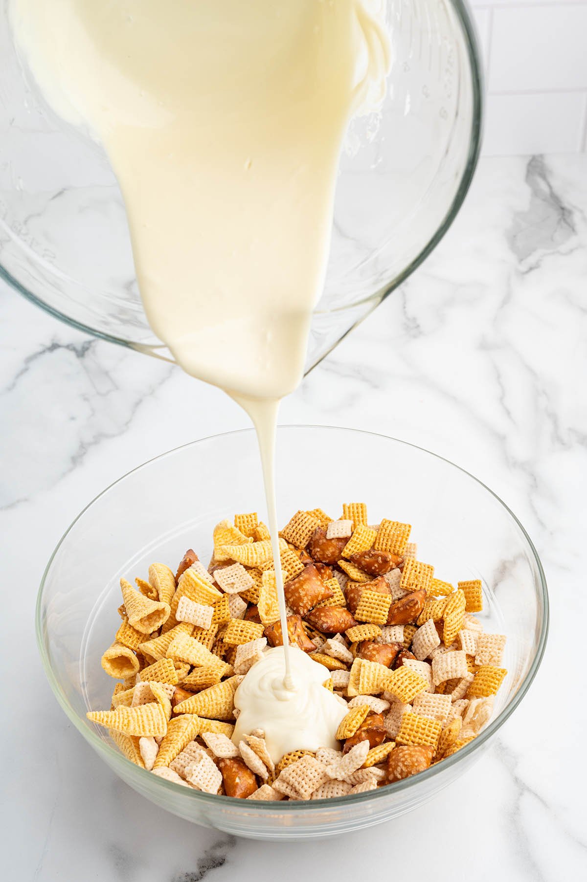pour the white chocolate into the chex mix. 