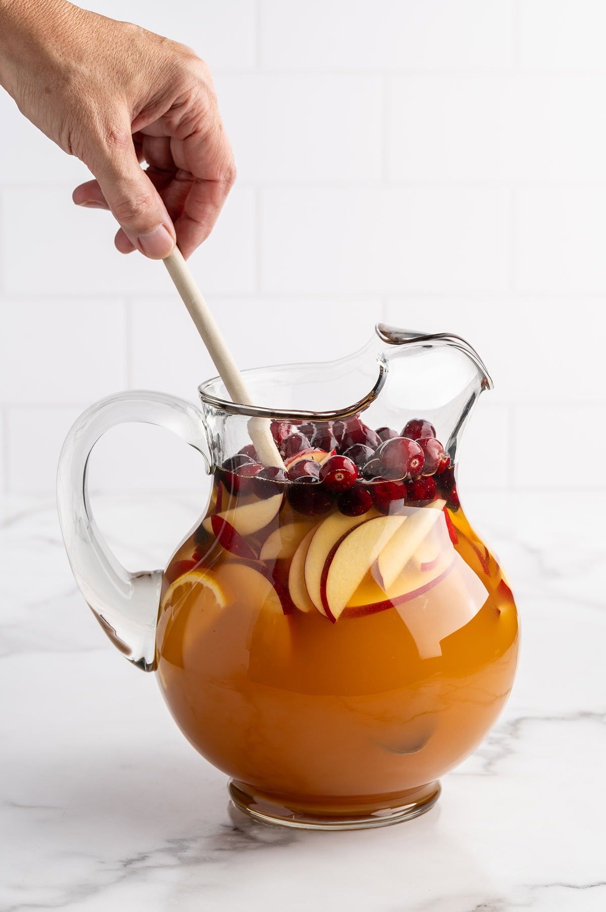 mixing fireball sangria.