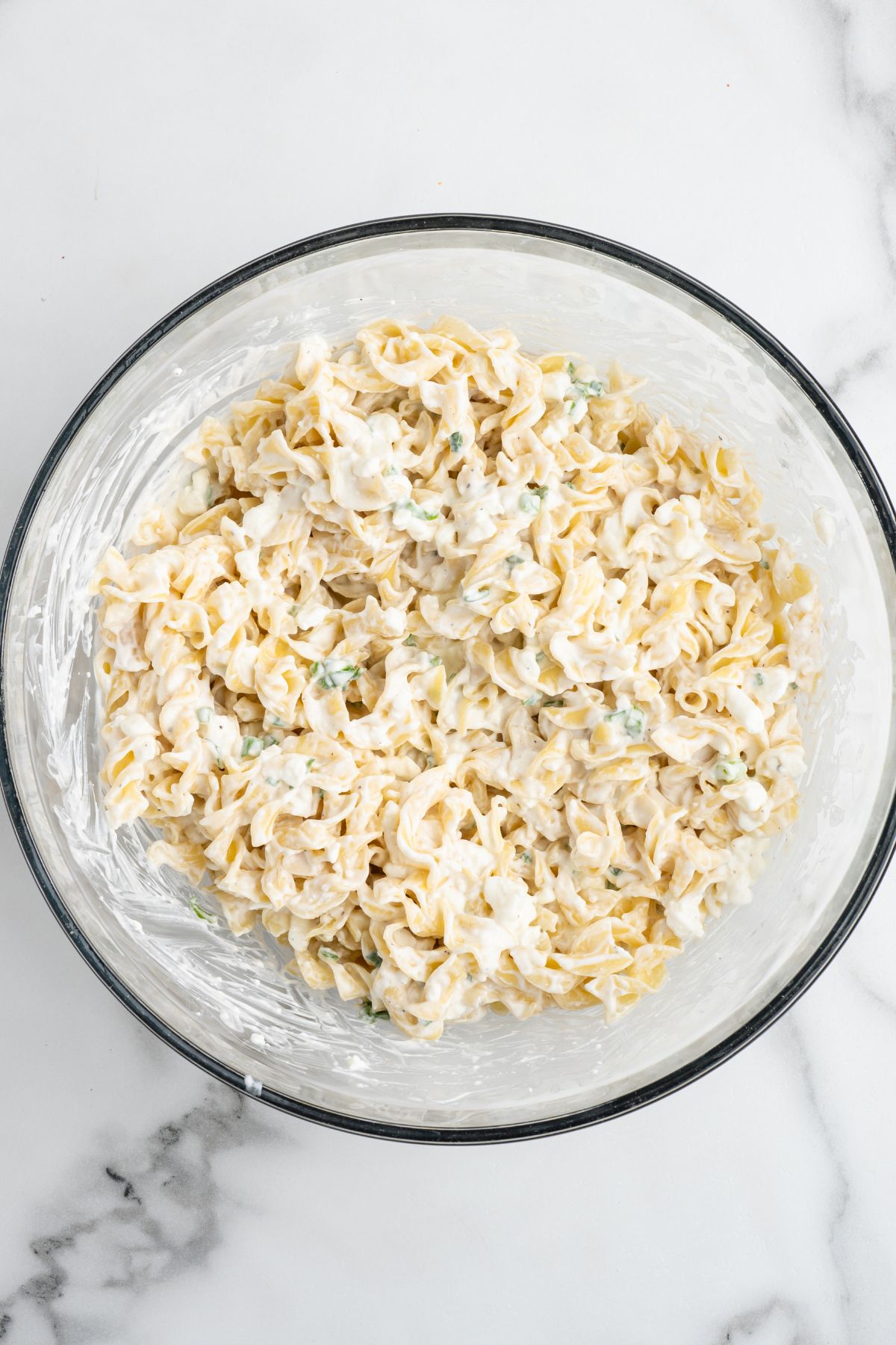 mix the cooked noodles with sour cream mixture.