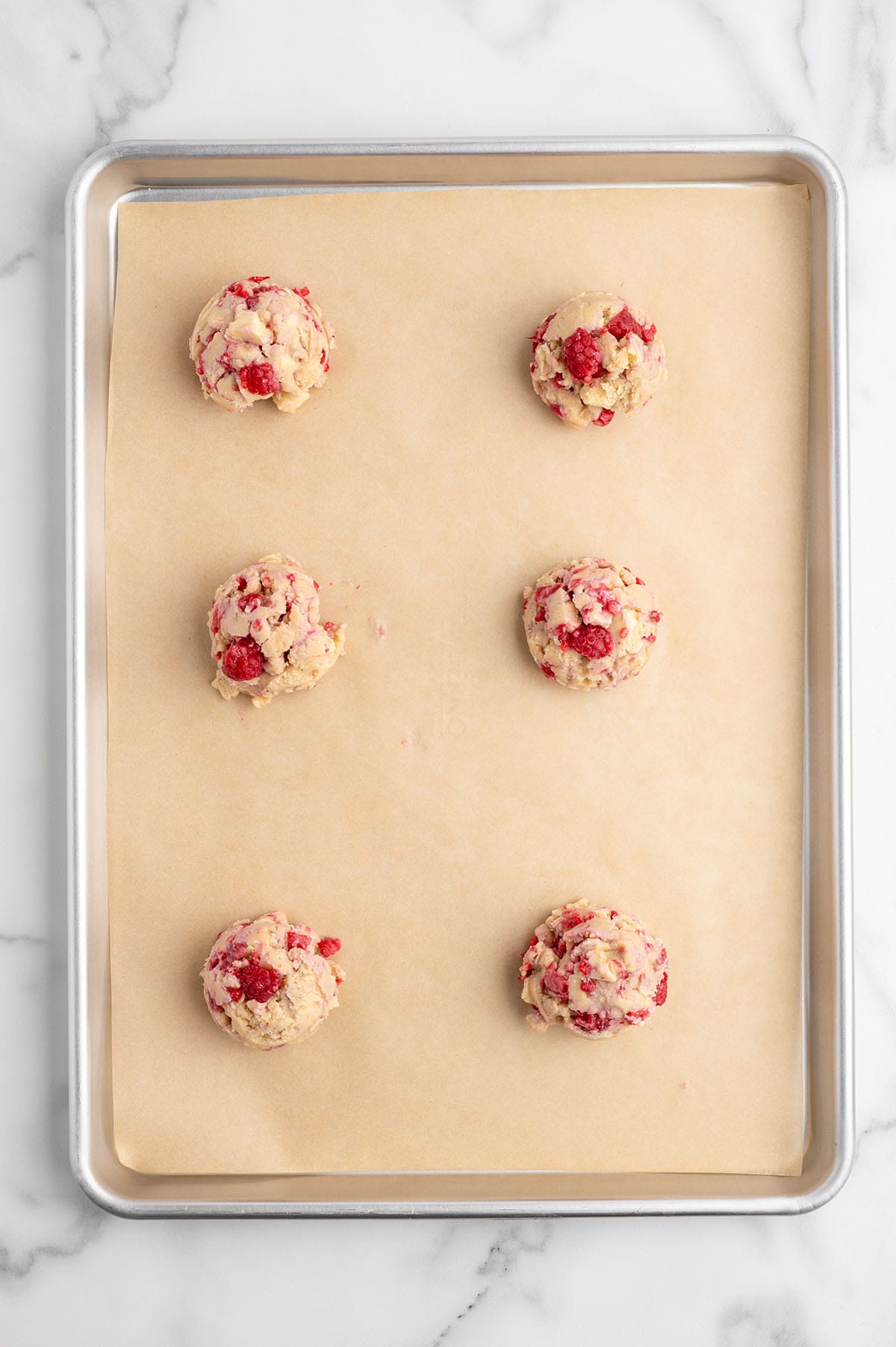 scoop cookie dough and place in baking sheet.