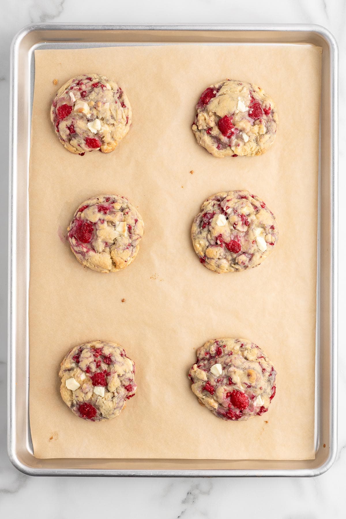 baked cookies on top of baking sheet.