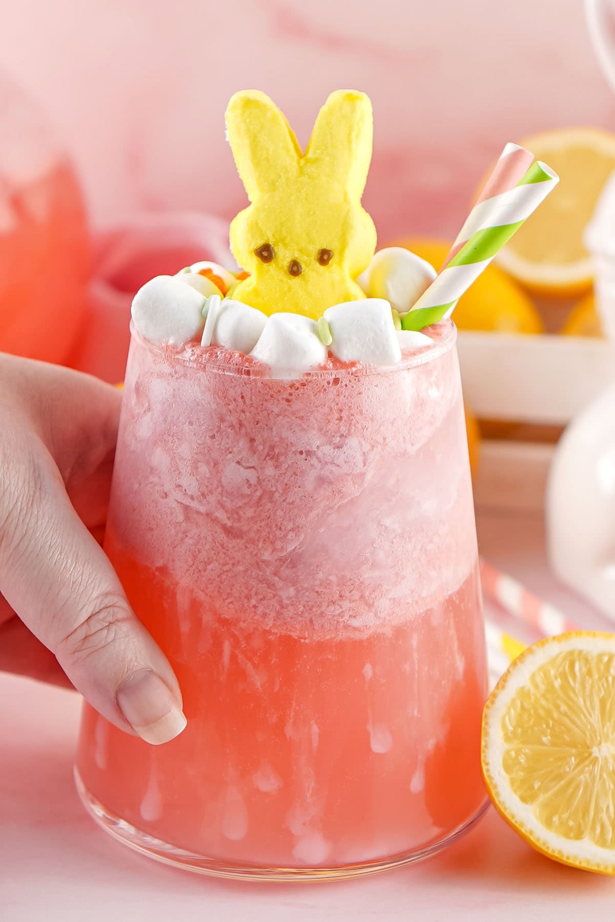 hand holding easter punch glass. 